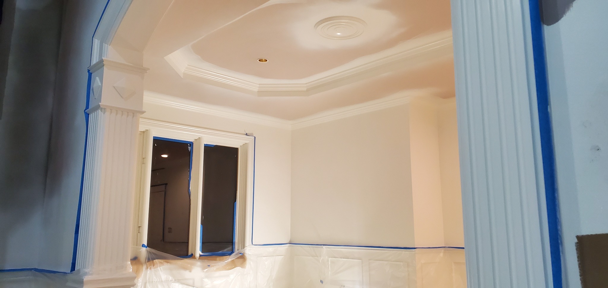 Before: interior walls and trim during preparation and masking