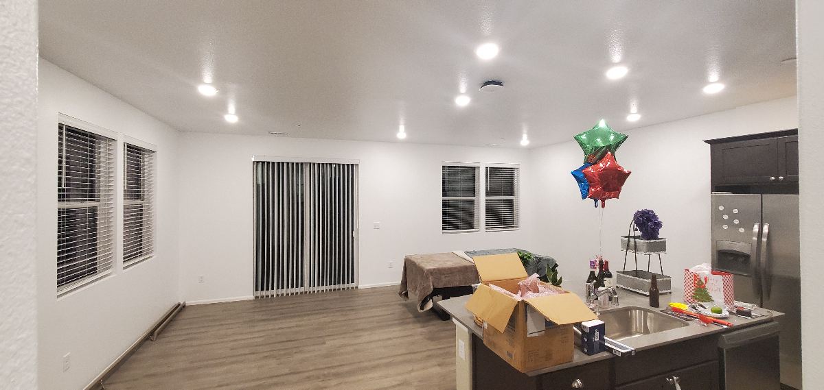 Freshly painted walls and ceiling in an open living and dining area