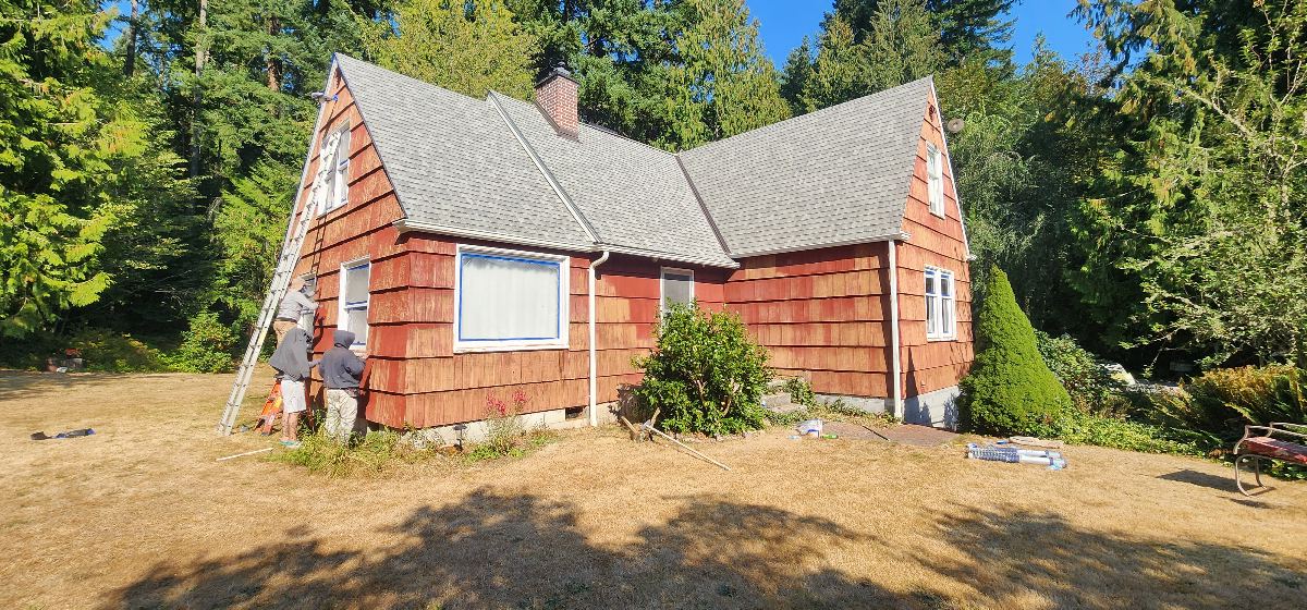 Exterior siding during scraping and preparation