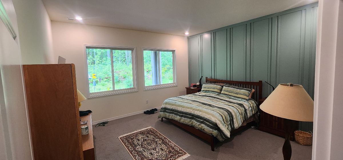 Bedroom after decorative accent wall installation and painting